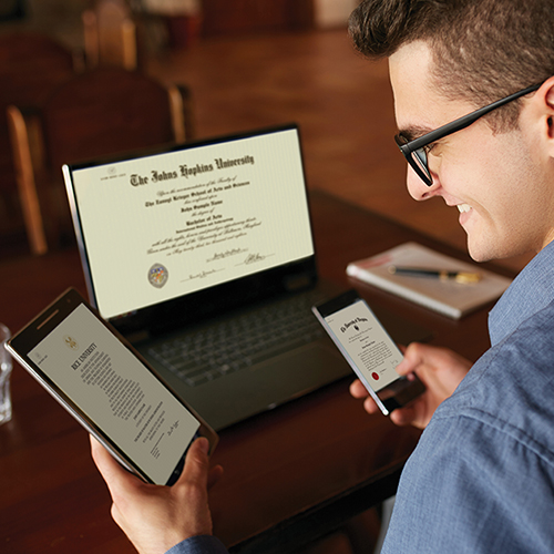 Graduate accessing Paradigm’s secure digital diplomas and certificates on laptop, tablet, and phone — institution-verified, shareable academic credentials.