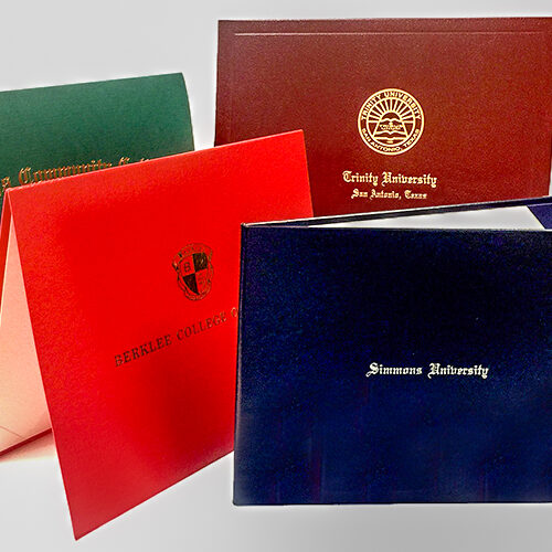 Custom diploma covers from Paradigm featuring university seals and logos — high-quality, professional presentation for graduation credentials.